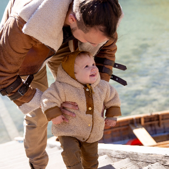 young child walking up stairs in cold weather